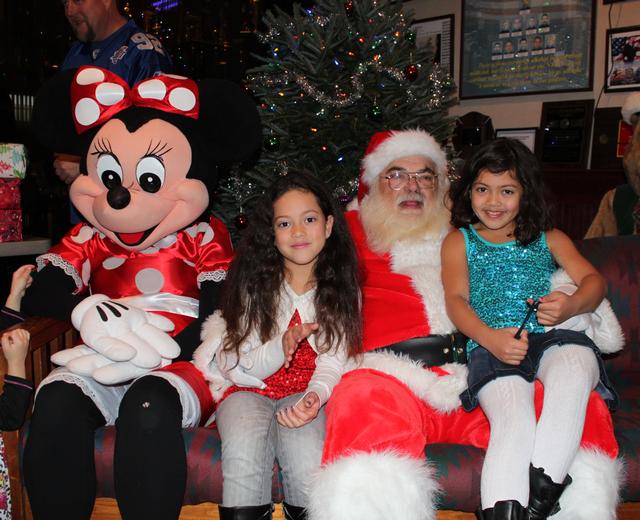 Children's Christmas Party at 8-100. 12-9-2012. Santa pays a visit . Photo by Vincent P. Tuzzolino